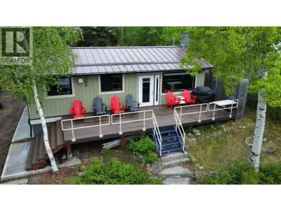 This charming lakefront cabin is truly move-in ready, just launch the boat and start making memories...