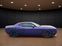 The 2023 Dodge Challenger SRT Hellcat Jailbreak in a stunning purple hue captivates with its rear-wh... (image 4)