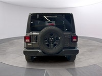 Get ready to command attention with the 2026 Jeep Wrangler Sport, a true symbol of adventure and rug... (image 3)