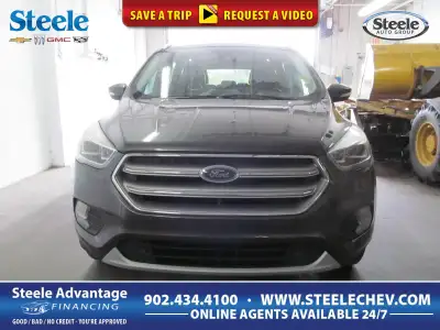 Up to any task, our top-of-the-line 2017 Ford Escape Titanium 4WD is a knockout in Ingot Silver! Pow...