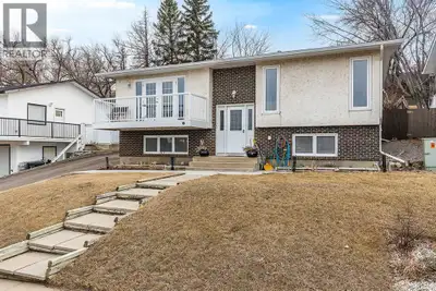 Beautiful 4-bedroom bi-level in a fantastic location close to the hospital, offering stunning river...