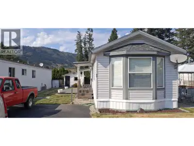 Well cared for 2 bed 2 bath mobile in a clean, very well ran 55+ adult oriented park, nestled betwee...