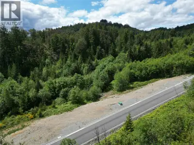 Backed by a serene forested ridge and boasting southern exposure, this fully serviced, build-ready l...