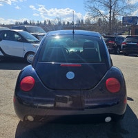 Turn heads and rediscover the joy of driving with this classic 2005 Volkswagen Beetle in a stunning... (image 4)