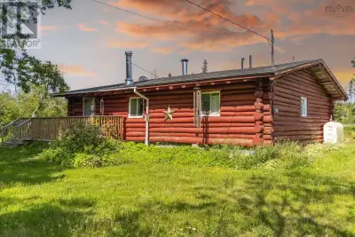Rare LOG Home in West River Station! This charming one-level home features a large eat-in kitchen, c...