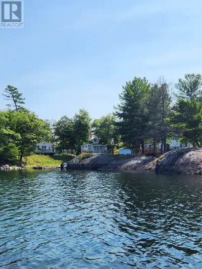 SPECTACULAR WATERFRONT COTTAGE WITH PANORAMIC VIEWS & UNMATCHED PRIVACY! Welcome to the serenity of...