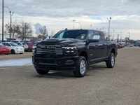 The 2026 Ram 2500 Laramie Mega Cab in Diamond Black Crystal Pearl combines heavy-duty capability wit... (image 1)