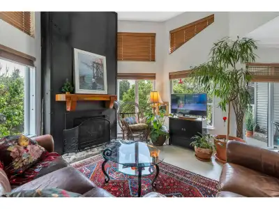 Step into this exceptional 1108 sq ft top-floor, corner unit condo, where farmhouse charm meets the...