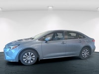 The 2023 Toyota Corolla Hybrid LE in stunning gray, boasts a fuel-efficient FWD drivetrain known for... (image 4)