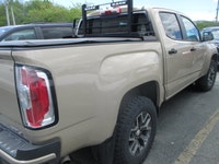 Finished in Desert Sand Metallic with a Black interior, this 2022 GMC Canyon 4wd At4 Cloth brings mi... (image 2)
