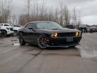This 2016 Dodge Challenger R/T is powered by a classic 5.7L HEMI V8 engine paired with a smooth auto... (image 1)