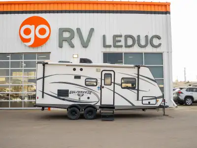A comfortable RV with a practical floorplan, inviting living space, and convenient features for trav...