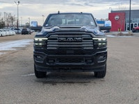 The 2026 Ram 2500 Laramie Mega Cab in Diamond Black Crystal Pearl combines heavy-duty capability wit... (image 9)