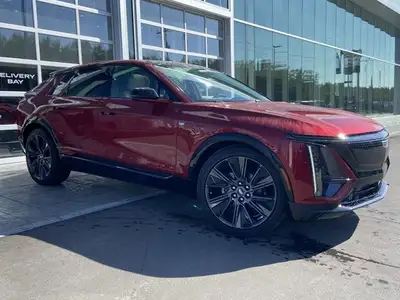 The 2026 Cadillac LYRIQ Signature Sport, finished in Radiant Red Tintcoat with a refined Oxford Ston...