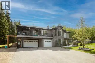 Acreage living at it's finest! A rare find with 10 secluded acres on pavement! Welcome to this stunn...