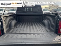 Experience the power and finesse of the 2026 Ram 3500 Laramie 4x4 Mega Cab, cloaked in a bold blue t... (image 4)