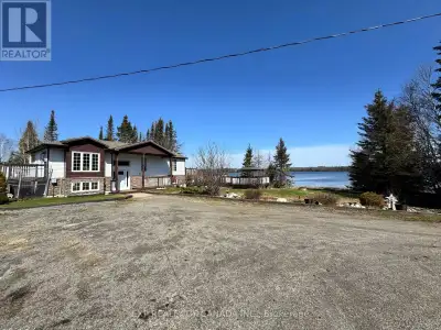 This water front home and detached garage are nestled on a manicured 2 acres lot with mature trees a...