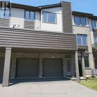 This spacious, bright, 3 levels townhouse has 4 exclusive parking spaces, double garage & double dri...
