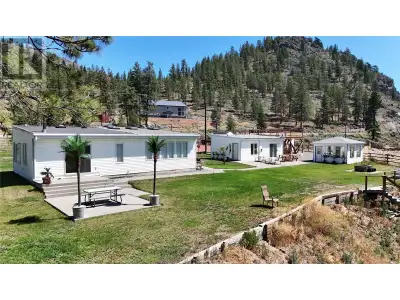 Visit REALTOR website for additional information. Riverfront Hobby Farm Oasis with Incredible Views...