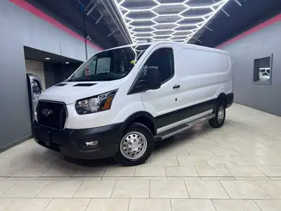The 2024 Ford Transit Cargo Van T-250 130 Low Rf 9070 GVWR AWD in pristine white is a formidable veh...