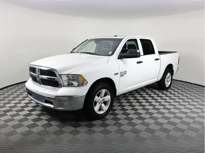 Our 2023 RAM 1500 Classic SLT Crew Cab 4X4 provides capability, control, and convenience in Bright W...