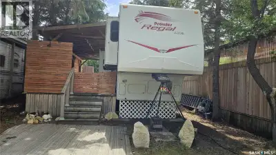 Escape to lake life at Poplar Beach RV Resort with this titled lot that comes fully equipped for you...