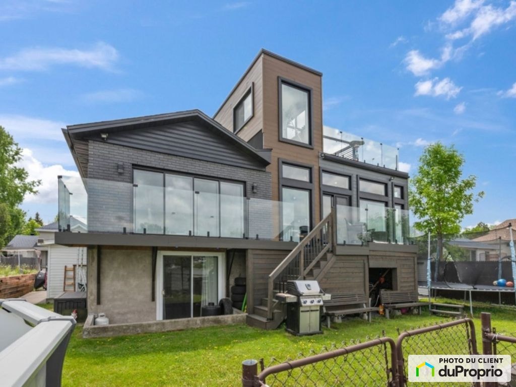 $969,000 - Bungalow for sale in St-Francois — photo 1