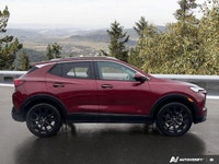 Navigate every season with confidence and comfort in the eye-catching Red 2025 Buick Encore GX Sport... (image 5)