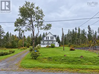 Sitting on a gentle hill, overlooking the water, this beautiful and majestic waterfront home offers...