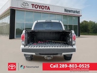 The 2019 Toyota Tacoma TRD Off Road 4x4 Double Cab V6 in a stunning white color with a robust 4x4 dr... (image 7)