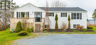 OVER 225 FEET OF OCEANFRONT! This beautifully updated 5-bed, 2-bath home offers a rare combination o...