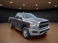 Meet the 2022 Ram 3500 Tradesman in an attractive brown hue with a robust 4x4 drivetrain, built to h... (image 2)