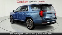 The 2025 GMC Yukon Elevation combines bold styling, spacious versatility and powerful performance in... (image 3)