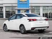 The former daily rental 2024 Nissan Versa SV, dressed in an eye-catching Aspen White TriCoat, presen... (image 3)