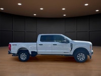 The 2023 Ford Super Duty F-250 SRW XLT in striking white comes equipped with a robust 4x4 drivetrain... (image 5)