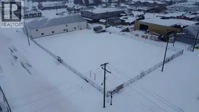 Available for lease! 28000 sq. ft. industrial lot with security fence on 1st Ave in Wainwright (id:2...