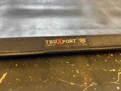 We have a slighty used Truxedo Truxport part # 272401 for a 20 GMC/CHEV 1500 5.8 box. Retail - $540...