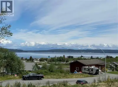 Cleared lot near the end of a quiet cul-de-sac with stunning harbour and ocean views framed by majes...