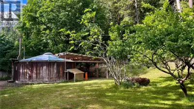 Nestled on a beautifully tiered 0.43-acre property, this unique island offering combines convenience...