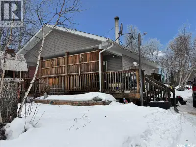 Located in the Sunset Cove subdivision at Cowan Lake, this bungalow-style cabin sits on a hillside l...