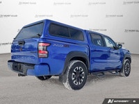 Awarded a 2024 IIHS Top Safety Pick, this striking blue 2024 Nissan Frontier Crew Cab Pickup excels... (image 6)