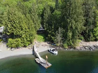 Escape to your ideal recreational getaway on the serene shores of Harrison Lake. Located in beautifu...