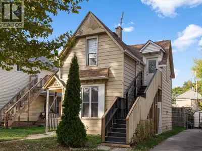 Freshly renovated upper unit with 2 beds, 1 bath, new floors, open-concept layout, and laundry hooku...