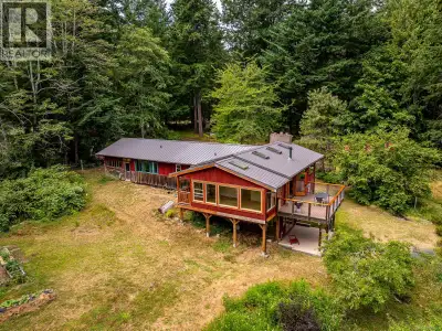 On nearly 5 acres overlooking peaceful Morrison Marsh, this spacious and eclectic family home offers...