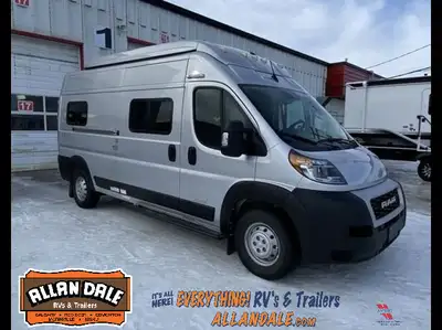 Adventure-ready camper van featuring a pop-top sleeping area, smart off-grid capabilities, compact k...