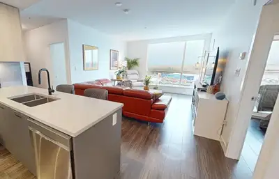 SAVE THE GST!! 1 YEAR YOUNG 2-BED + DEN 2-BATH TOP FLOOR SUITE with PANORAMIC WATER AND MOUNTAIN VIE...