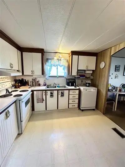 R32//McAuley/Welcome to this well-maintained 2-bedroom mobile home with a spacious addition, nestled...