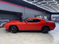 Meet the 2022 Dodge Challenger GT in a vibrant orange finish, gracefully combined with an AWD drivet... (image 1)