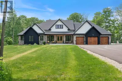 Your dream countryside retreat is here! Just minutes from every convenience, this custom-built moder...