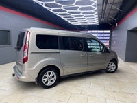 Experience the elegance and sophistication of the gold 2015 Ford Transit Connect Wagon Titanium with... (image 1)